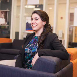 Mary Zeouli '15 smiling and looking upwards.