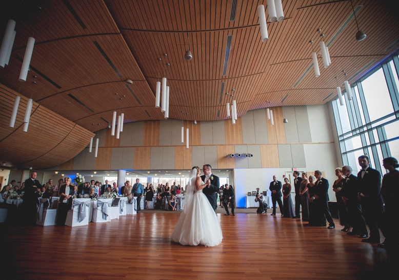 couple on dance floor with guests