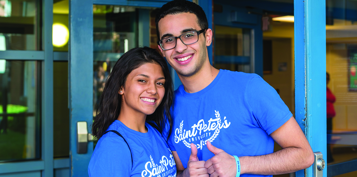 female and male student smiling